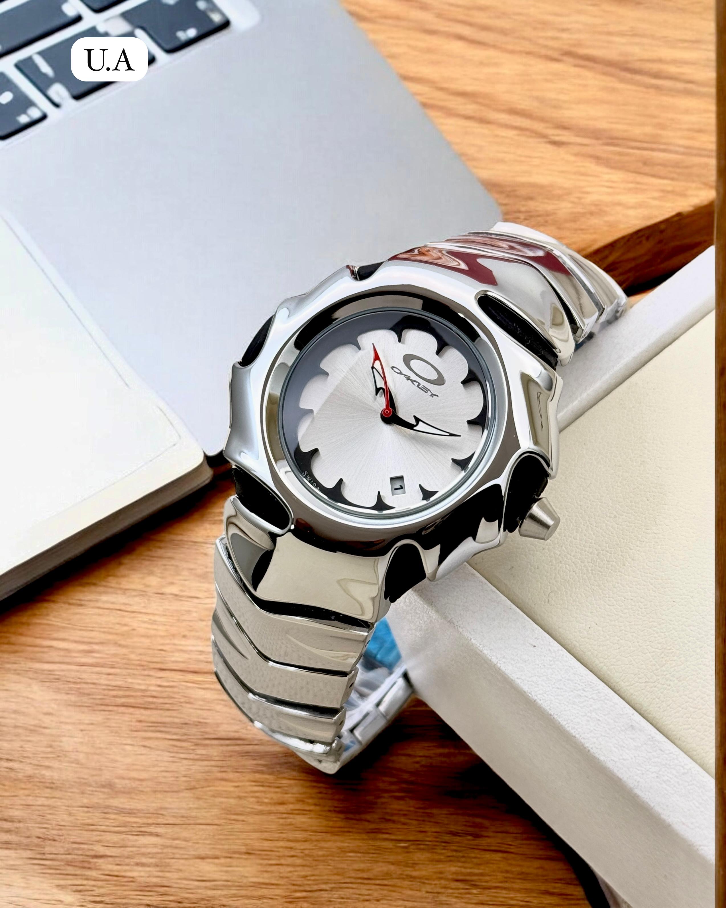 OAKLEY SILVER WHITE DATE WORKING METAL WATCH